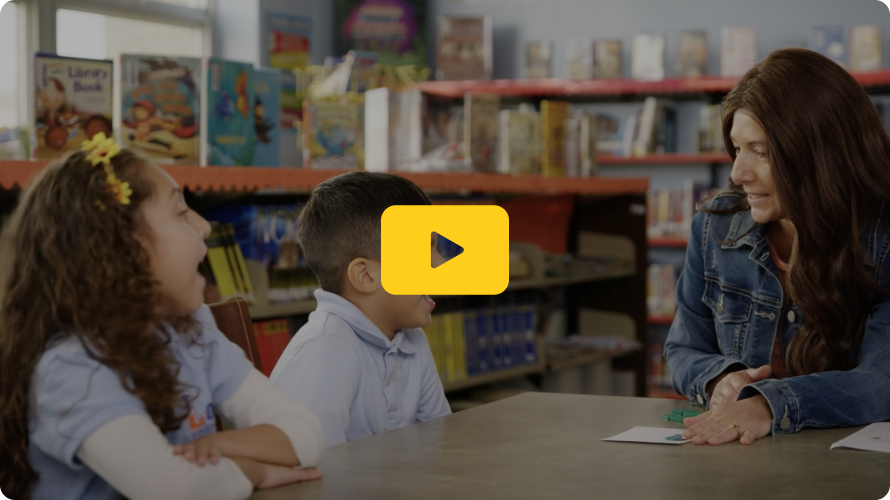 Educator using reading flash cards with students