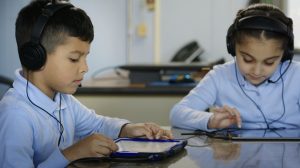 Two students use EarlyBird's dyslexia screener on iPads.